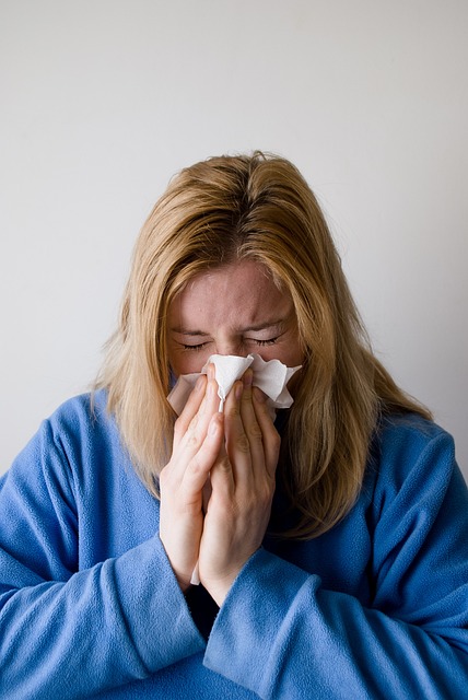 woman sneezing because of allergy